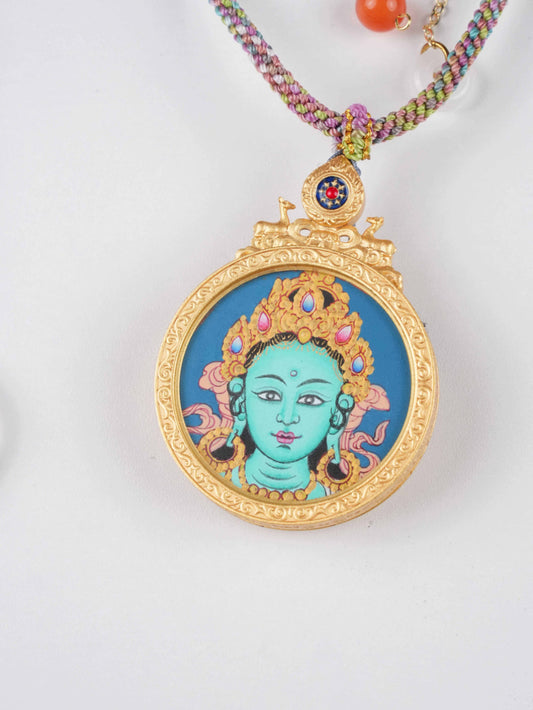 Hand-painted Tibetan Green Tara Thangka Gau pendant symbolizing compassion and protection.