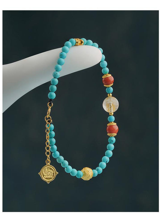 Tibetan Buddhist Jewelry Culture - Close-up of a handmade green turquoise mala bracelet, featuring individually hand-painted beads on an elastic cord, symbolizing peace and spiritual growth.