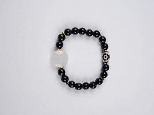 Hand-painted Tibetan Buddhist Vajrapani mini thangka bracelet on canvas with natural mineral pigments, showcasing detailed Buddha art symbolizing strength and protection.