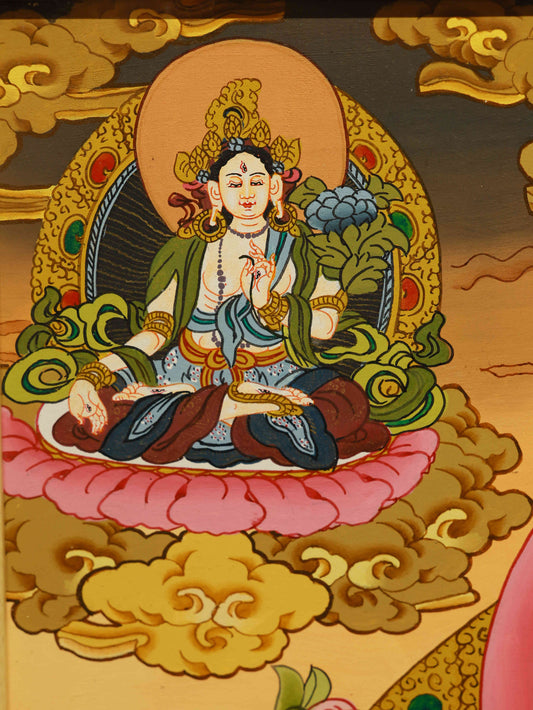 Tibetan Thangka painting of Yellow Jambhala, handmade with mineral pigments.