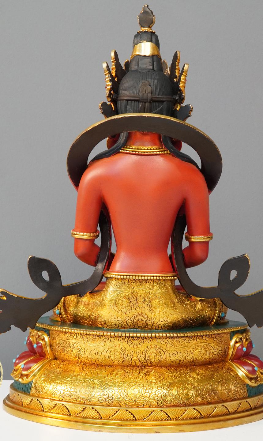 Handcrafted brass Long Life Buddha statue with gilding and mineral pigment painting, representing Tibetan Buddhist art.
