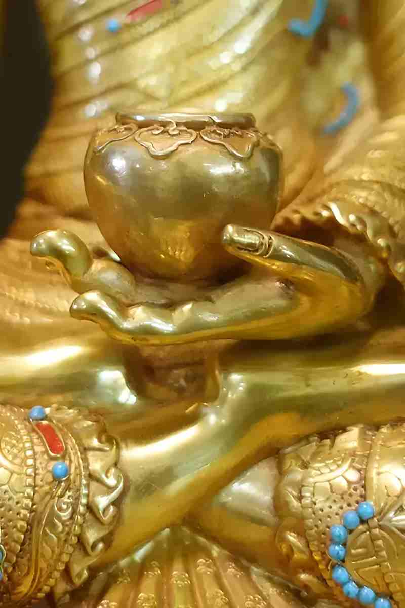 "Hand-painted brass Gautama Buddha figure, blending Tibetan Buddhist artistry with fine craftsmanship."