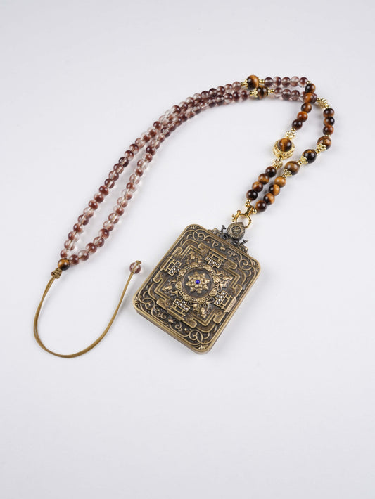 Mini Tibetan Thangka pendant of Vairocana symbolizing enlightenment, peace, and zodiac harmony.