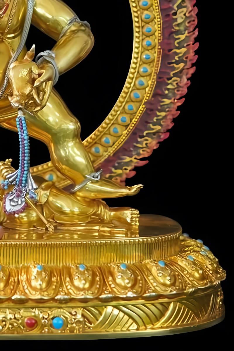 Handmade Tibetan Buddhist Black Jambhala wealth god statue featuring mineral colors, reflecting profound Buddhist statue culture.