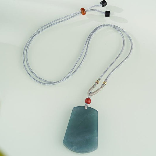 Natural handcrafted blue jade necklace reflecting tranquility and spiritual protection.