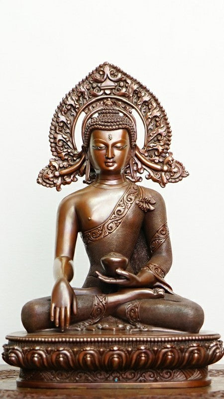 Handmade Tibetan Shakyamuni Buddha Statue in copper with mineral pigments, symbolizing wisdom and spiritual enlightenment, perfect for meditation spaces.