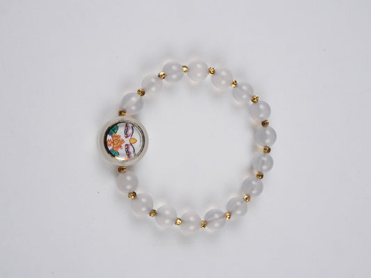 Hand-painted Tibetan Buddhist White Tara mini thangka bracelet made from canvas and mineral pigments, symbolizing peace and longevity in Tibetan Buddha art.