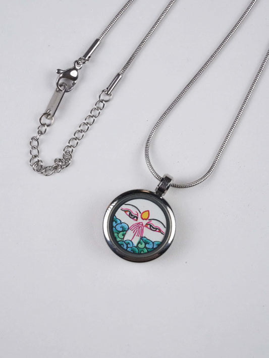 Hand-painted Tibetan Buddhist White Tara mini thangka pendant necklace, crafted on thangka canvas with mineral pigments. A sacred piece of Tibetan Buddha art symbolizing compassion and longevity.