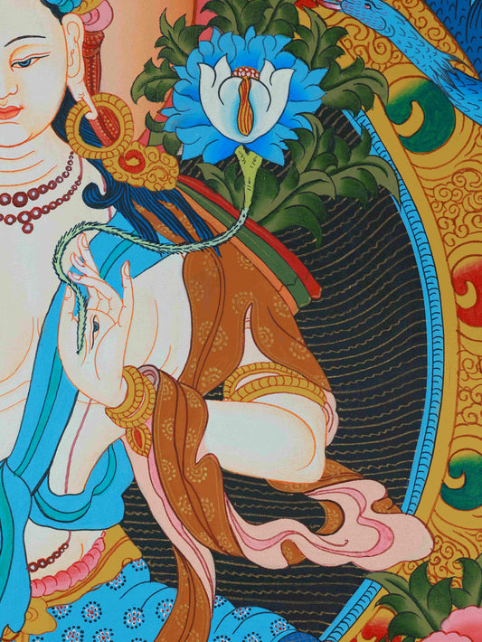 Tibetan Thangka painting of White Tara, hand-painted on canvas with mineral pigments, sacred artwork.