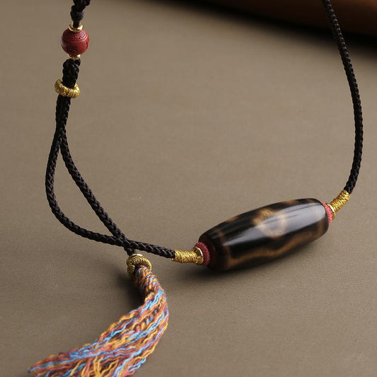 "Tibetan Buddhist Huixin Eyes Magnetic Agate Pendant with Thangka Art, crafted with Copper and Zhushā for meditation and balance."