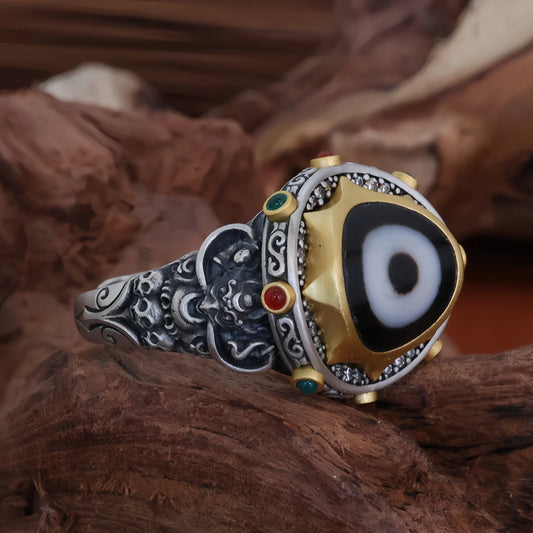 Hand-painted silver Peng Bird One-Eye ring inspired by Tibetan Buddhist Jewelry Culture, a unique jewelry art piece symbolizing protection and spiritual insight.