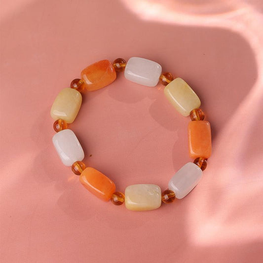 A hand-painted square Quartzite Jade mala bracelet featuring intricate Buddhist symbols. Each bead is carefully painted by artisans, making this spiritual jewelry art piece a powerful meditation tool.