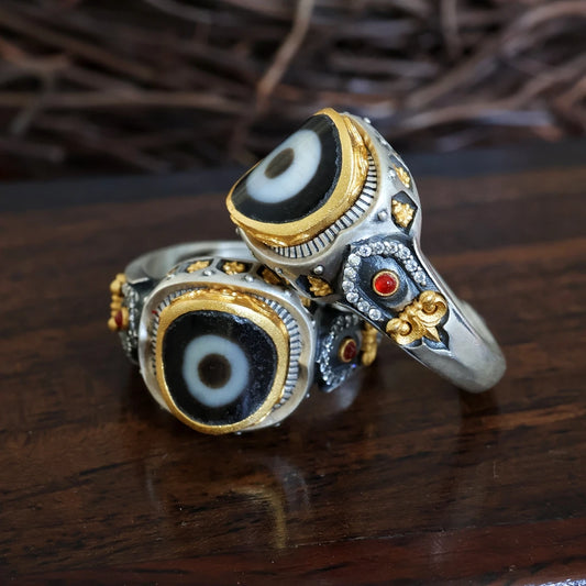Hand-carved silver One-Eyed Formless Buddha ring from Tibetan Buddhist Jewelry Culture, showcasing intricate jewelry art and traditional handcraft.