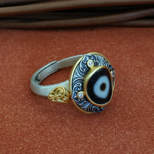 Hand-painted silver One-Eye Bead ring inspired by Tibetan Buddhist Jewelry Culture, a unique jewelry art piece symbolizing spiritual insight.