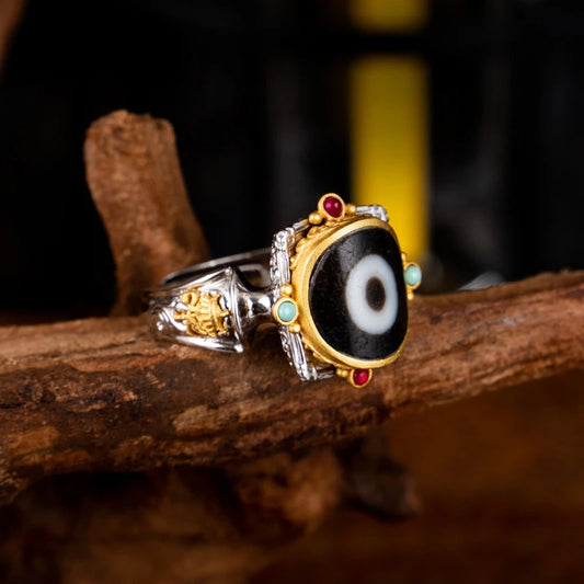 Hand-painted silver One-Eye Umbrella ring inspired by Tibetan Buddhist Jewelry Culture, a unique jewelry art piece symbolizing protection and spiritual blessing.