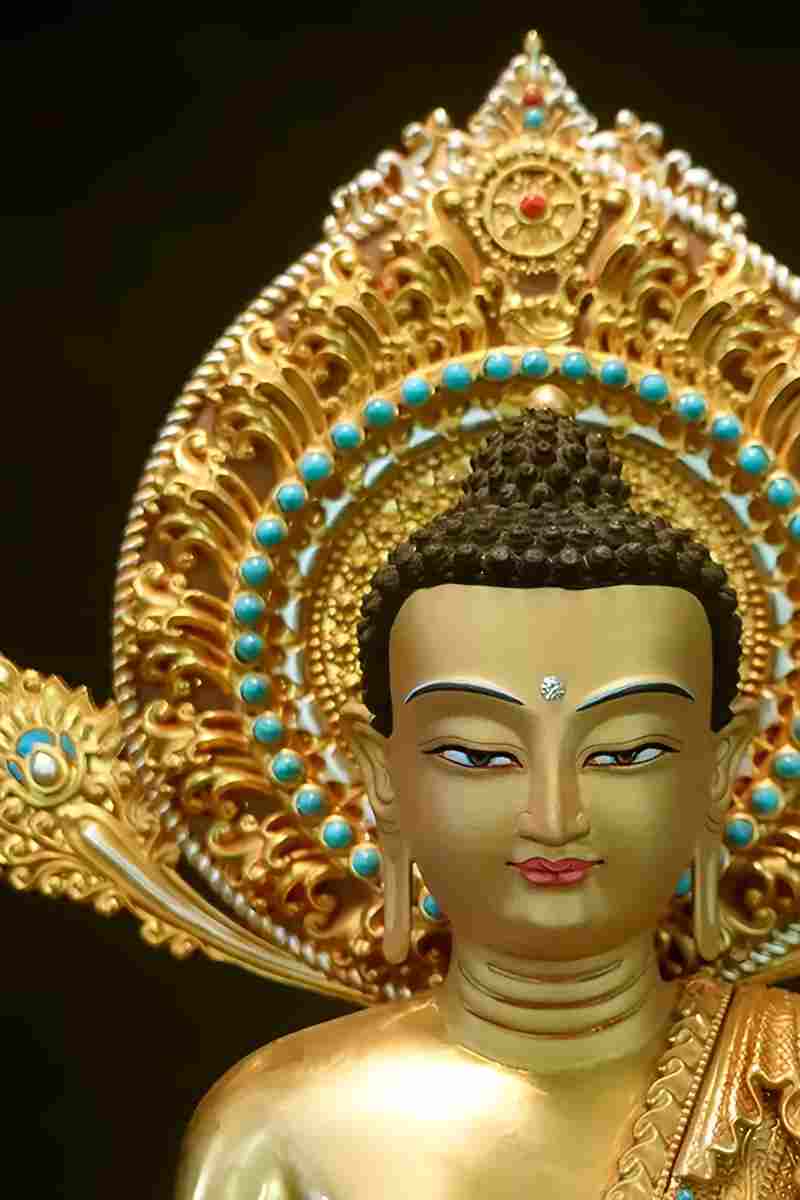 "Brass Buddha statue with hand-painted Kyastha art, showcasing the beauty of Tibetan Buddhist craftsmanship."