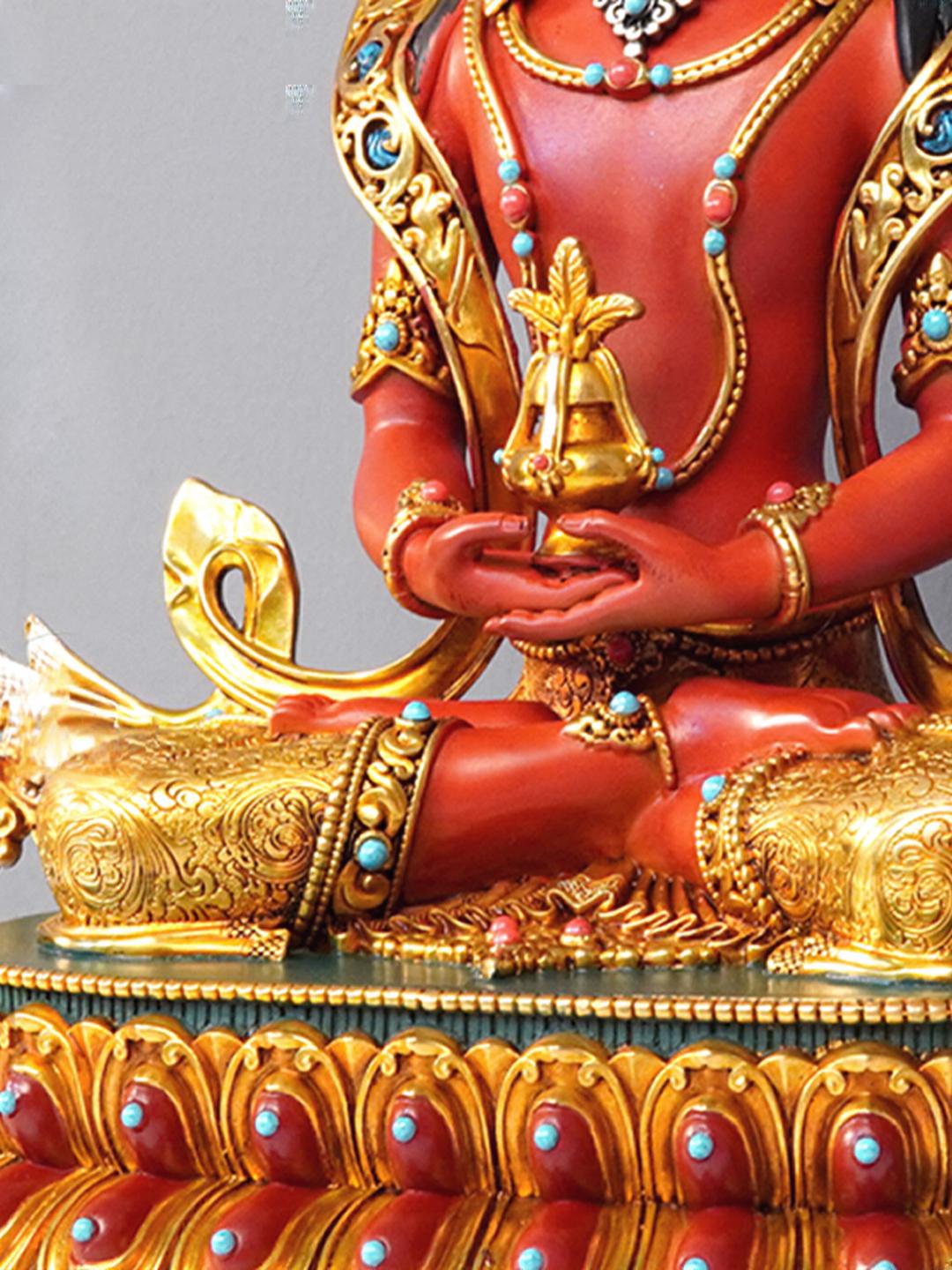 Tibetan Buddhist Long Life Buddha statue in gilded brass, with mineral pigment painting, reflecting traditional Buddhist aesthetics.