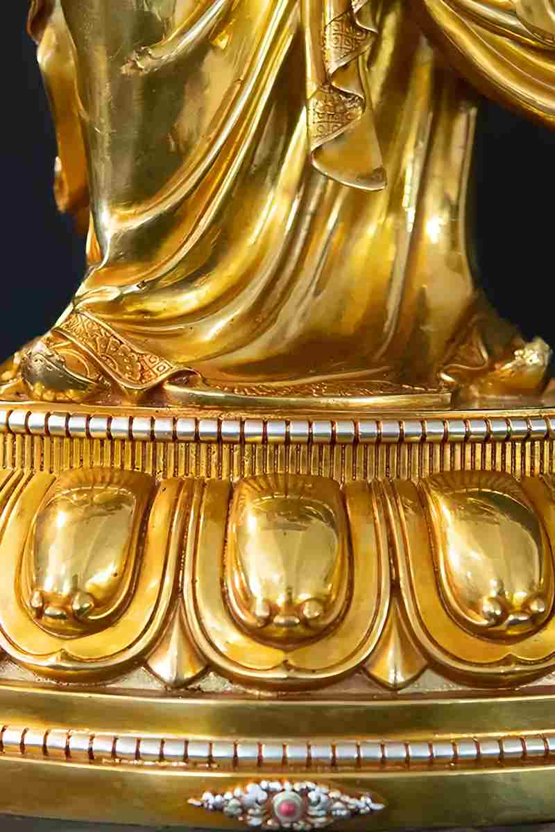 Tibetan Buddhist Lotus Born Lama statue, handcrafted from brass, with mineral paint and intricate details in Buddha statue art.