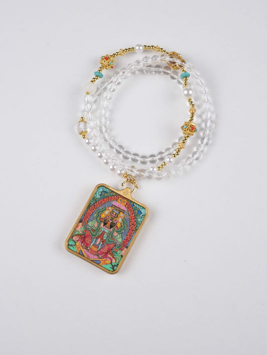 Mini Tibetan Thangka pendant featuring Mahakala, crafted on canvas with mineral pigments.