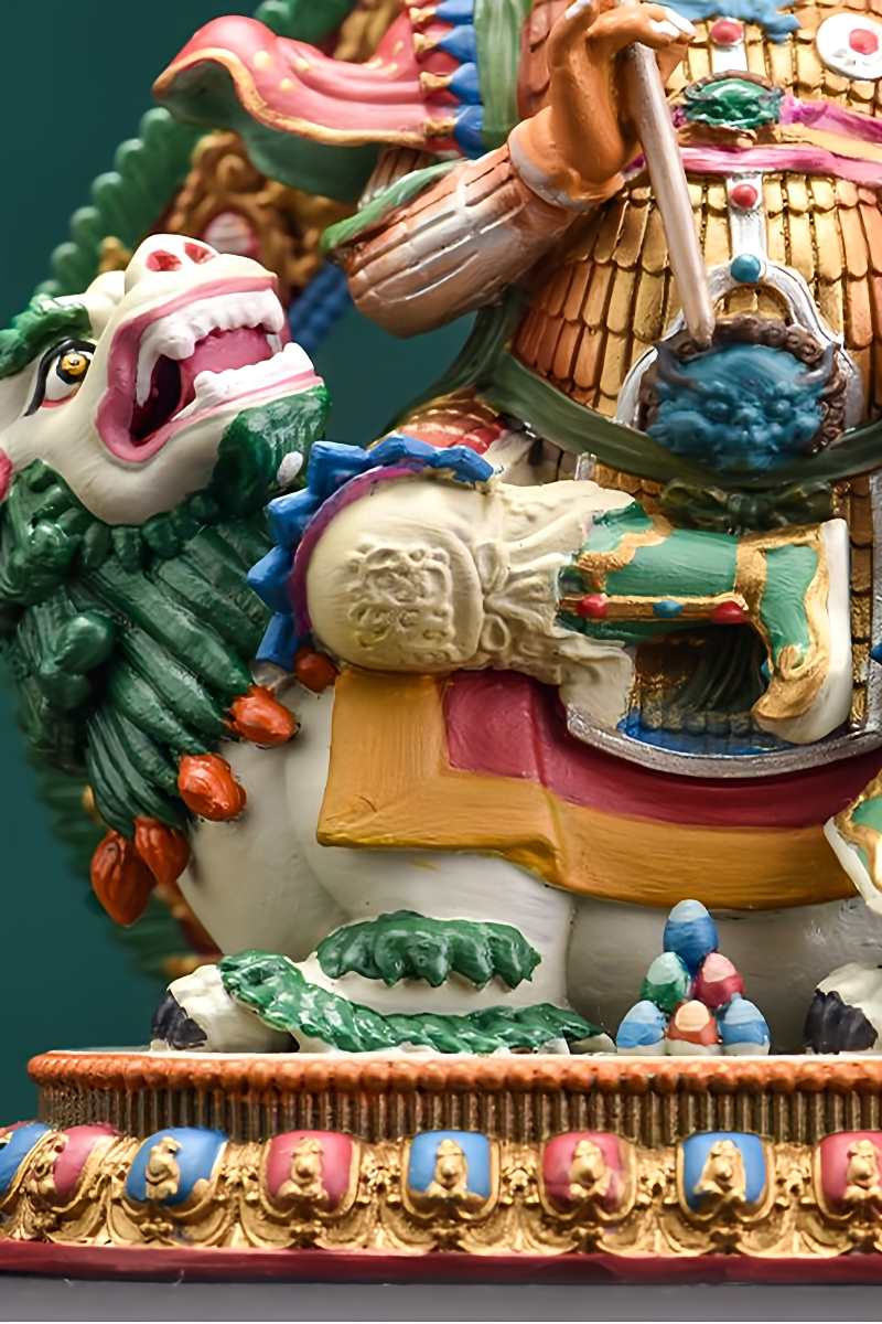 Tibetan-buddhist Dzambhala miniature statue, handcrafted in copper with hand-painted details, traditional Tibetan Buddha art.