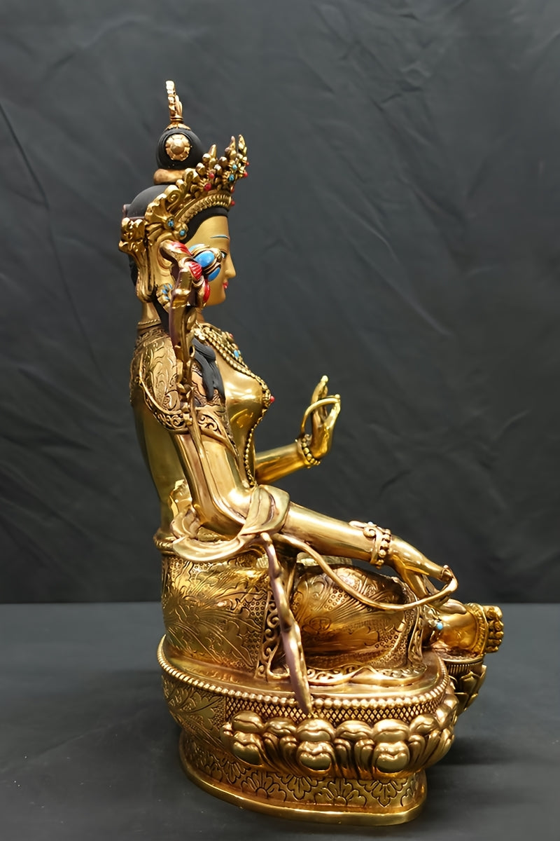 Tibetan Buddhist Green Tara statue in golden copper, finely handcrafted, symbolizing compassion, peace, and spiritual awakening.
