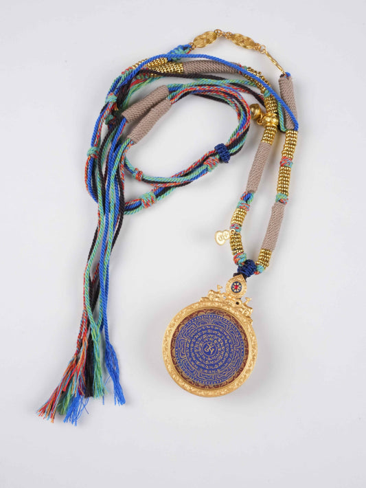 : Mandala-style Om symbol thangka painting, collectible Tibetan Buddhist artwork with geometric sacred patterns and vibrant mineral colors