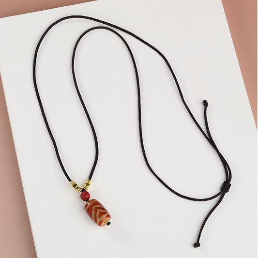 Tibetan Buddhist One-Eye Mountain Support Dzi Pendant made from red agate and potent cinnabar.