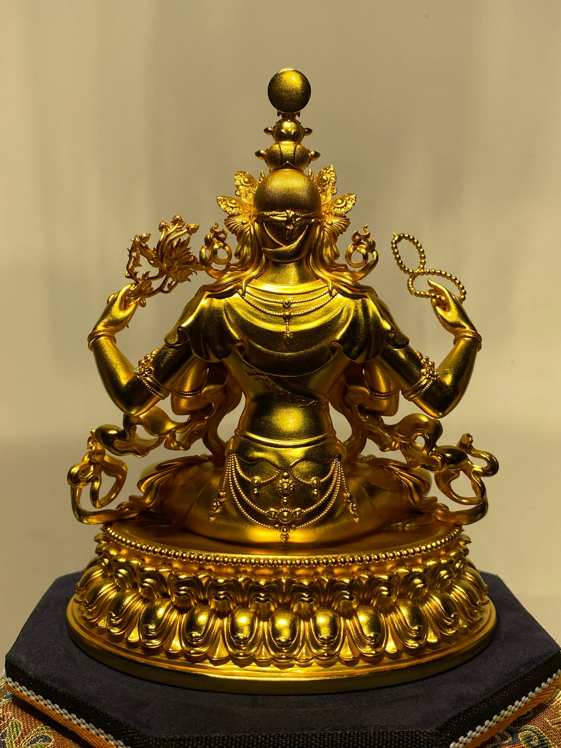 Tibetan-buddhist Vajrapani Bodhisattva silver-gilded handcrafted statue, detailed Buddha art with mineral pigment painting.
