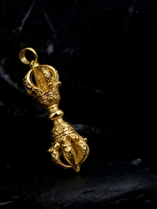 Handmade 24K gold-plated copper 9-spoke Vajra pendant, a symbol of indestructible wisdom in Tibetan Buddhist sacrificial implements culture.