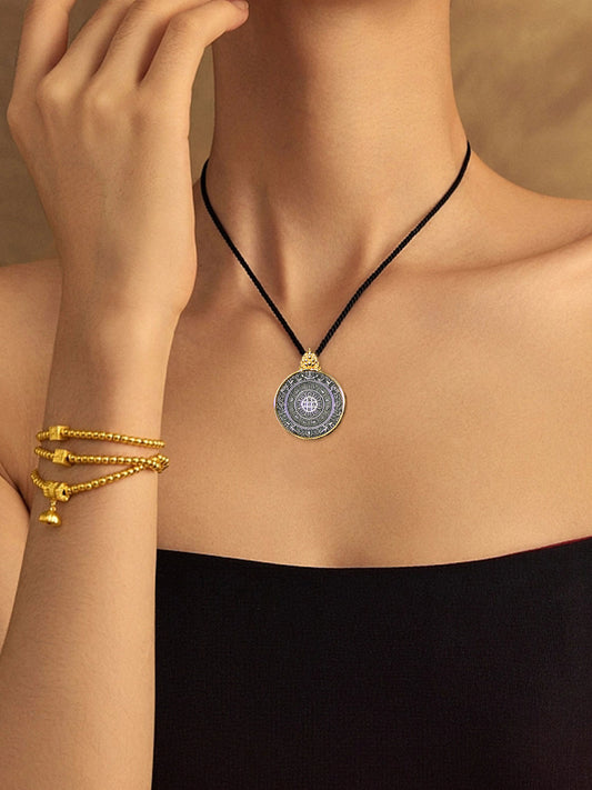 A spiritual practitioner wearing the vintage gold-over-silver talisman, representing the sacred Buddhist sacrificial items art for daily protection.