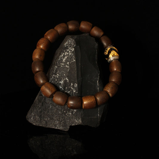 A practitioner wearing the tiger tooth Dzi agarwood beads for spiritual protection, representing the essence of Buddhist sacrificial items art.