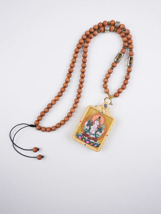 Authentic Tibetan Buddhist Thangka painting of Green Tara, hand-painted on traditional canvas with vibrant natural mineral pigments. Symbolizes compassion and enlightened activity.