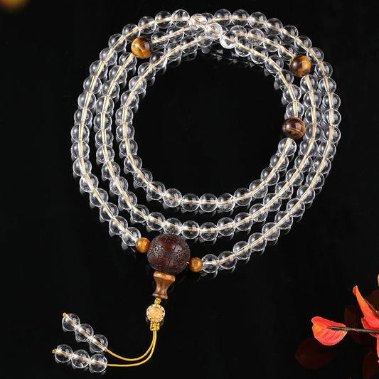 Tibetan Buddhist white crystal, tiger eye, and sandalwood 108 beads mala necklace for meditation and serenity.