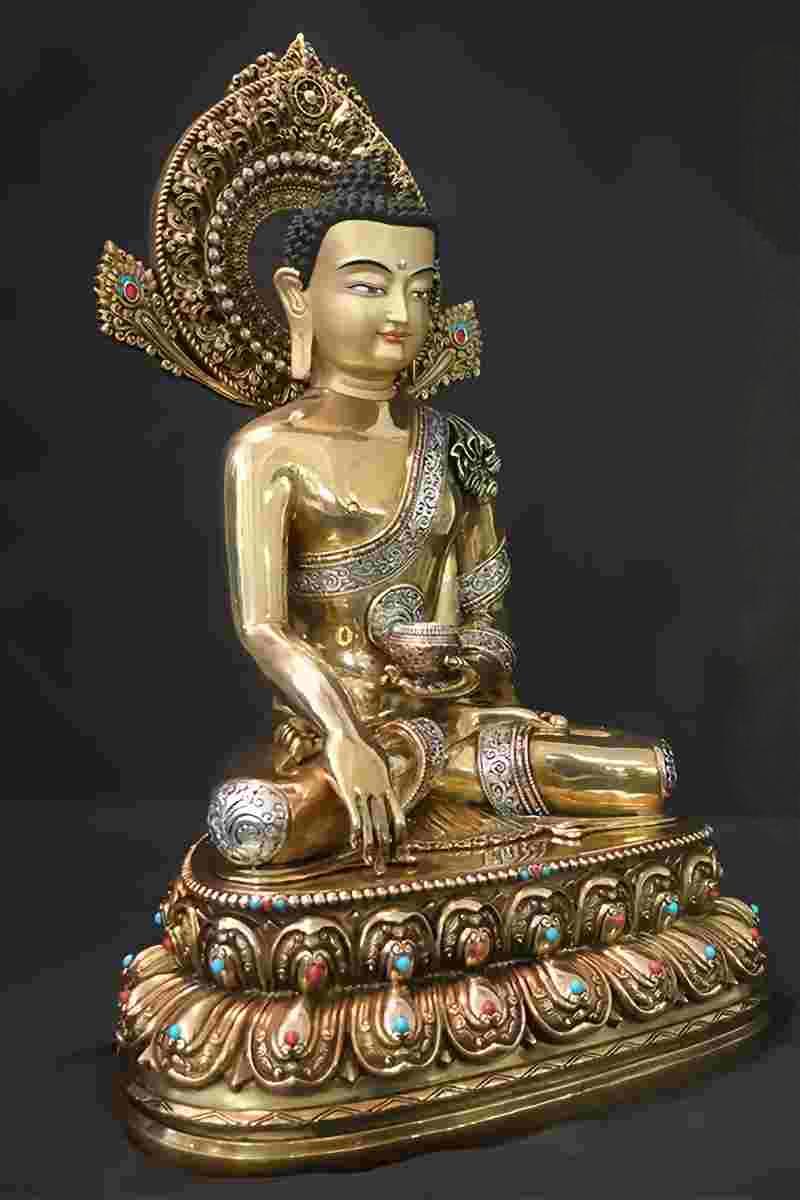 Golden engraved Shakyamuni Buddha brass painted statue, Tibetan Buddhist statues, Buddha Statue Art symbolizing compassion and serenity.