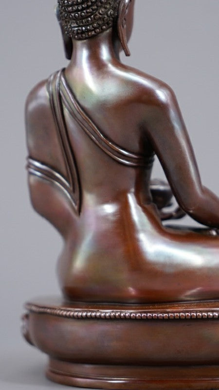 Handmade Tibetan Shakyamuni Buddha Statue in copper with mineral pigments, symbolizing wisdom, compassion, and spiritual enlightenment. Ideal for meditation spaces.
