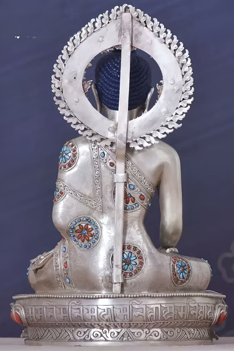 Handmade Tibetan-buddhist Shakyamuni Buddha, silver statue with mineral pigments, elegant piece of Tibetan Buddha art.