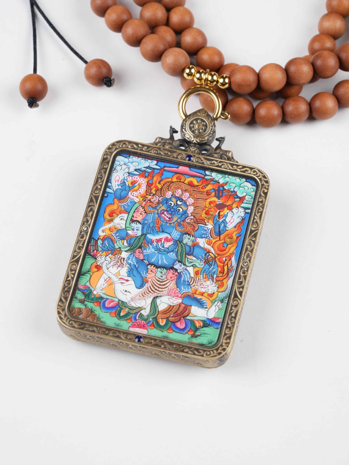Tibetan Buddhist Six-Armed Mahakala Gau amulet — a powerful protector deity in Thangka painting tradition.