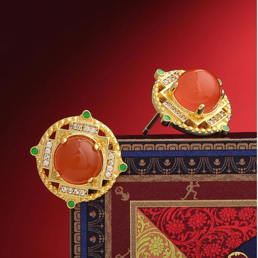 "Handmade Tibetan Buddhist Sheng Le Chang Huan ear studs with 925 silver and South Red Coral, symbolizing joy and spiritual bliss."