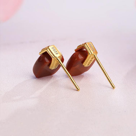 "Tibetan Buddhist-inspired 925 silver earrings with South Red Coral, offering spiritual significance and aesthetic beauty."