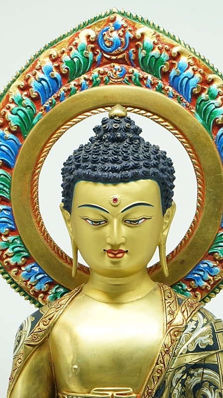 Alt text: Handcrafted Tibetan Buddhist Three Buddhas statue, meticulously painted with mineral pigments, showcasing unique artistic style and the traditional aesthetics of Tibetan Buddhism.