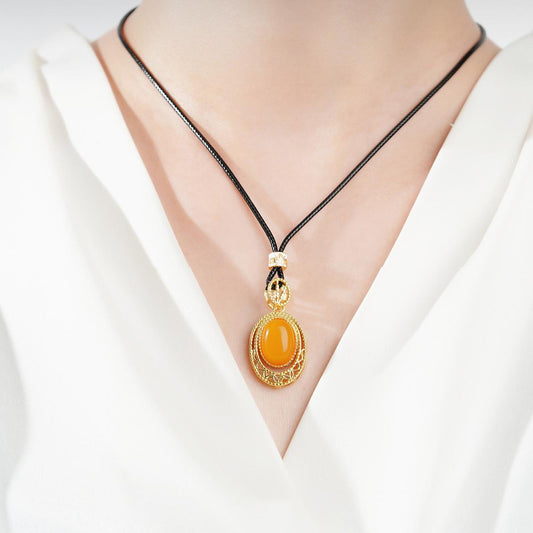 Tibetan Buddhist honey amber pendant necklace with thangka painting, featuring alloy and copper materials, traditional spiritual design.