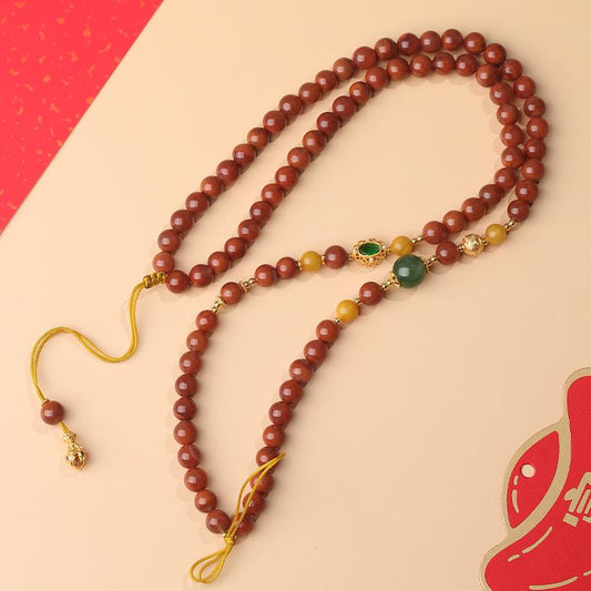 Alt text: "Tibetan Buddhist Thangka painting red agate necklace made from Sichuan material, featuring intricate craftsmanship and spiritual symbolism. Perfect for adding a sacred touch to your collection."