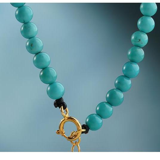 close-up of tibetan-buddhist turquoise beads bracelet, hand-painted Tibetan jewelry showing natural mineral texture and craftsmanship details
