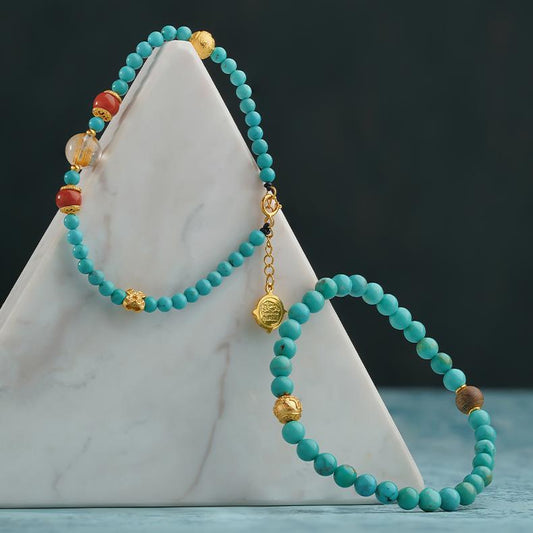 Tibetan Buddhist Jewelry Culture - Exquisitely handcrafted green turquoise stone bracelet, highlighting the skilled artistry and spiritual significance embedded in this sacred Tibetan adornment.