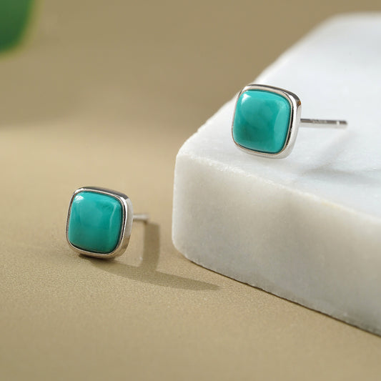 Handmade Tibetan-Buddhist turquoise earrings crafted in 925 silver, inspired by Tibetan Buddha art and spiritual symbolism.