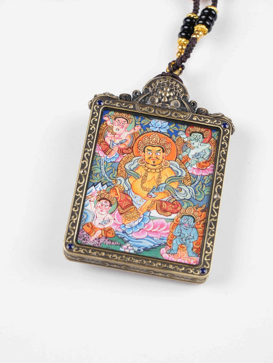Tibetan thangka painting of Yellow Jambhala, the Buddhist Wealth Deity – handmade with mineral pigments on canvas.