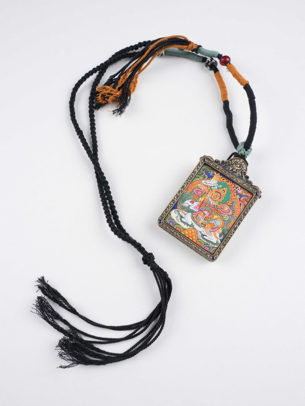 Tibetan Buddhist Vaisravana Wealth King thangka pendant, hand-painted on traditional thangka canvas with natural mineral pigments for abundance and protection.