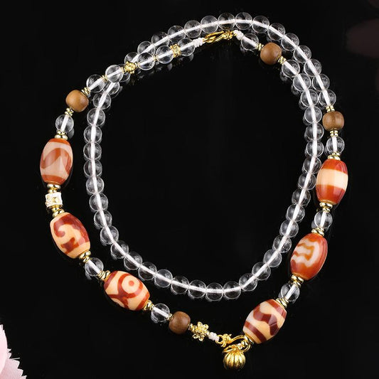 Handmade Tibetan Buddhist white crystal and red agate bead necklace with copper and old sandalwood beads for protection and vitality.