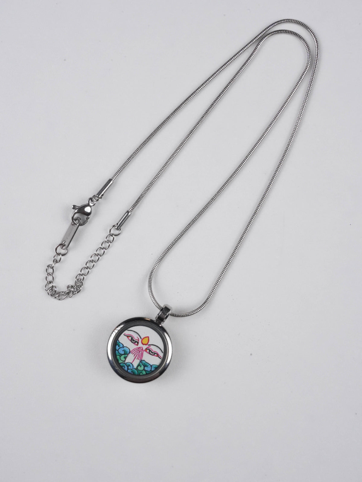 Exquisite Tibetan Buddha art White Tara mini thangka necklace, created with mineral pigments and fine craftsmanship, radiating serenity and compassionate energy.