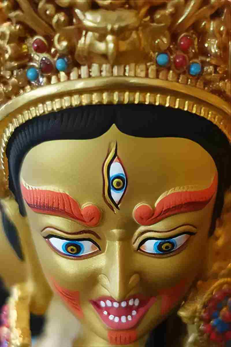 Authentic handmade brass Ushnisha Vijaya Buddha statue, Tibetan Buddhist art piece offering compassion, longevity, and obstacle protection.